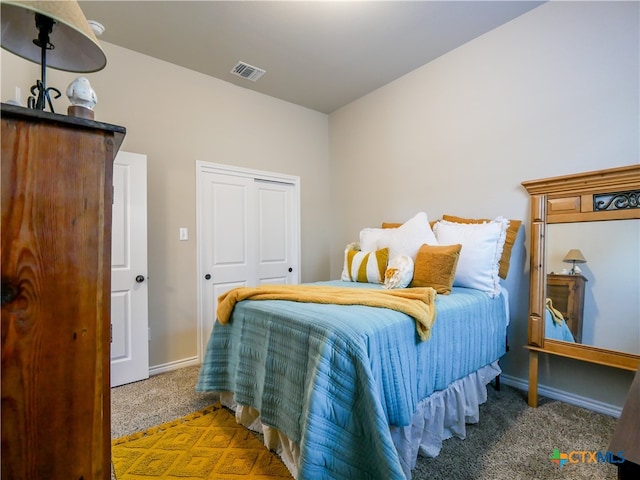 carpeted bedroom with a closet