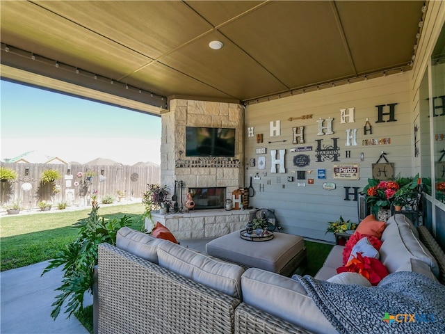 view of patio / terrace featuring an outdoor living space with a fireplace