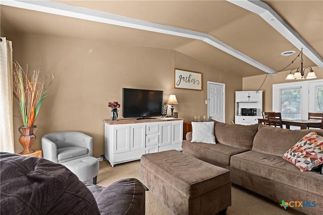 1400 Barbara Ln, Killeen, TX 76549 - living room featuring a chandelier, light carpet, and vaulted ceiling