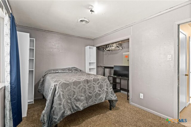 1400 Barbara Ln, Killeen, TX 76549 - carpeted bedroom featuring baseboards and a textured wall