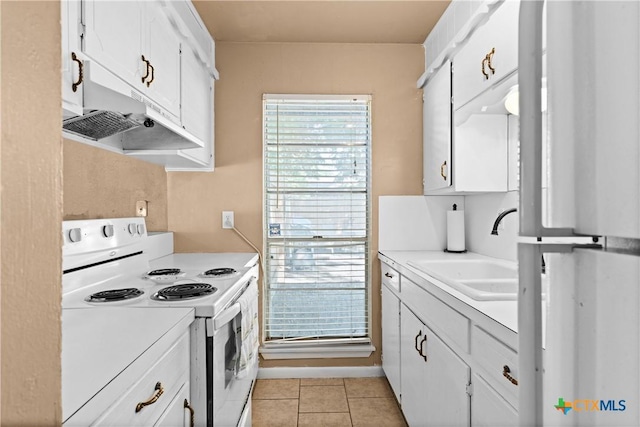 1400 Barbara Ln, Killeen, TX 76549 - kitchen with electric stove, a sink, light countertops, and white cabinets