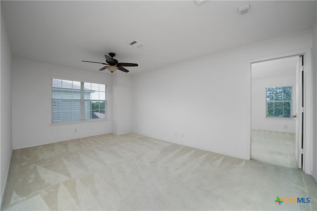 180 Beech Dr, Kyle, TX 78640 - empty room featuring light colored carpet and healthy amount of natural light