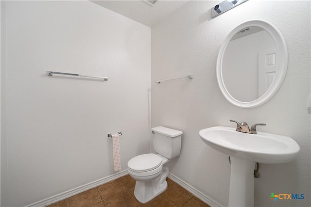 180 Beech Dr, Kyle, TX 78640 - half bathroom with tile patterned floors and toilet
