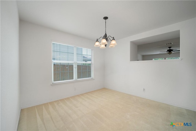 180 Beech Dr, Kyle, TX 78640 - spare room featuring a chandelier, carpet, and a ceiling fan