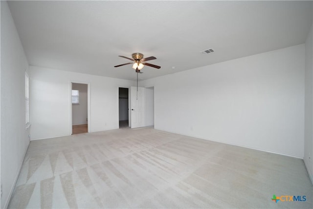 180 Beech Dr, Kyle, TX 78640 - empty room with a ceiling fan and light carpet