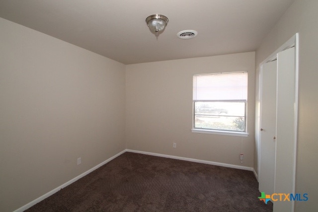 view of carpeted spare room