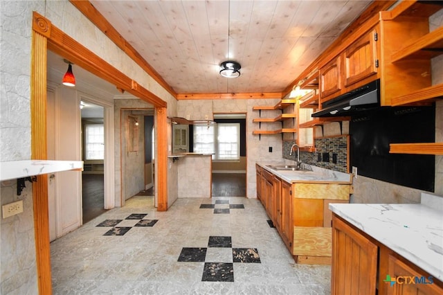 kitchen with ventilation hood, sink, decorative backsplash, light stone counters, and wooden ceiling