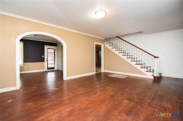 unfurnished living room with crown molding and dark hardwood / wood-style floors