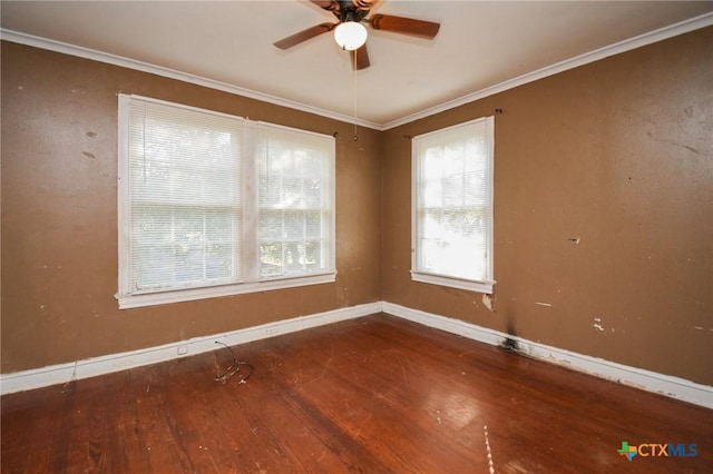 empty room with hardwood / wood-style flooring, ceiling fan, and ornamental molding