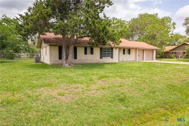 single story home featuring a garage, fence, a front yard, brick siding, and concrete driveway