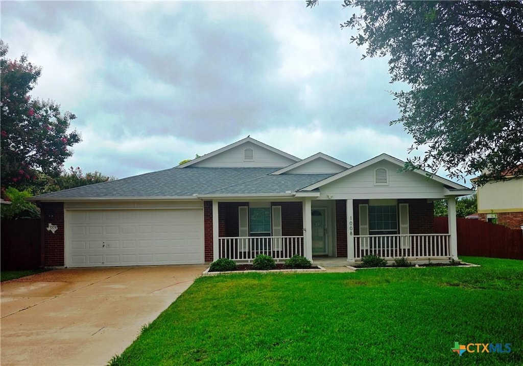 1008 Mustang Trl, Harker Heights, TX 76548 - ranch-style house featuring a porch, brick siding, an attached garage, concrete driveway, and roof with shingles