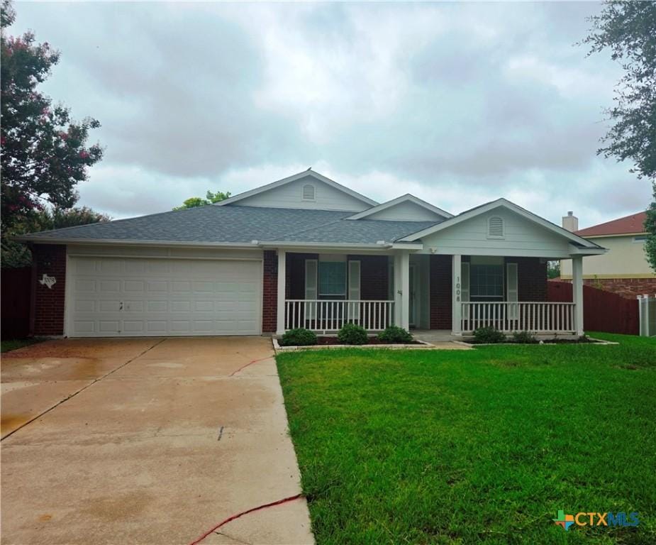1008 Mustang Trl, Harker Heights, TX 76548 - single story home with covered porch, driveway, an attached garage, and brick siding