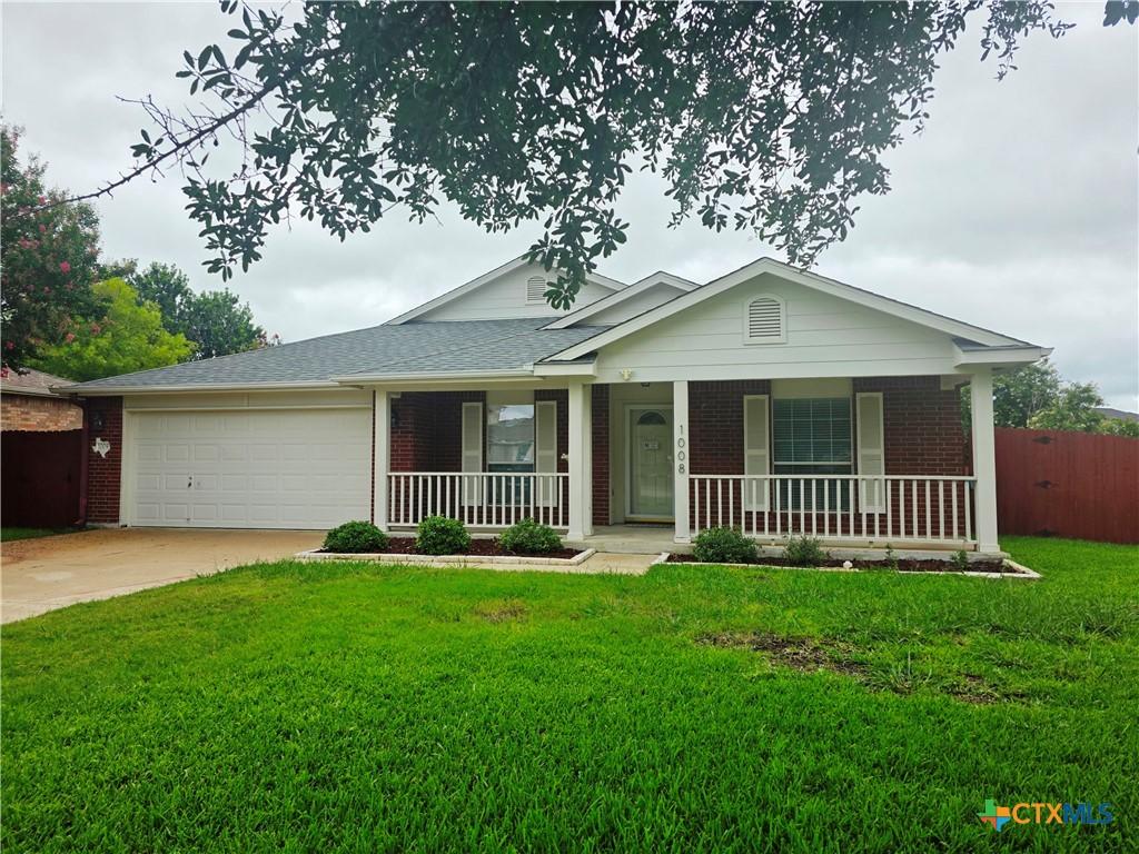1008 Mustang Trl, Harker Heights, TX 76548 - single story home featuring brick siding, covered porch, a garage, and concrete driveway
