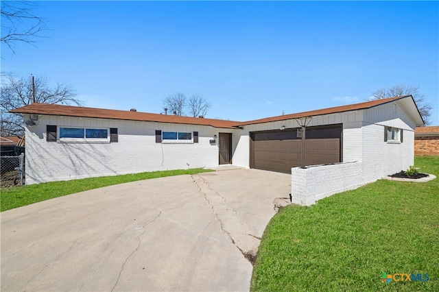 ranch-style home with a garage, brick siding, driveway, and a front lawn