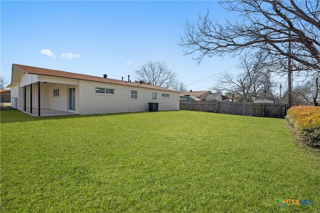 exterior space featuring a fenced backyard, a patio, and central AC