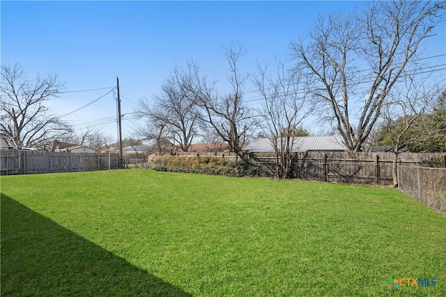 view of yard featuring a fenced backyard