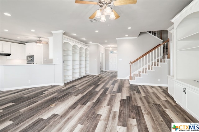 unfurnished living room with dark hardwood / wood-style floors, crown molding, and ceiling fan