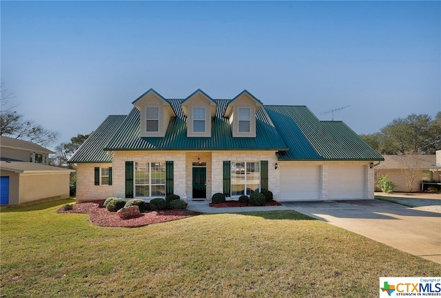 view of front of house with a front lawn and a garage