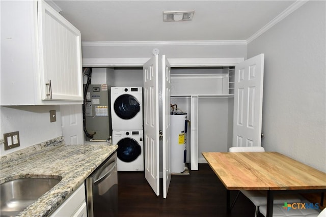 1624 Aquarena Springs Dr Unit G155, San Marcos, TX 78666 - laundry room with stacked washer / drying machine, electric water heater, dark wood-style flooring, and crown molding