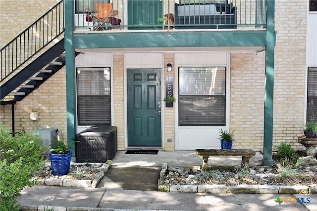 1624 Aquarena Springs Dr Unit G155, San Marcos, TX 78666 - entrance to property with a balcony and brick siding