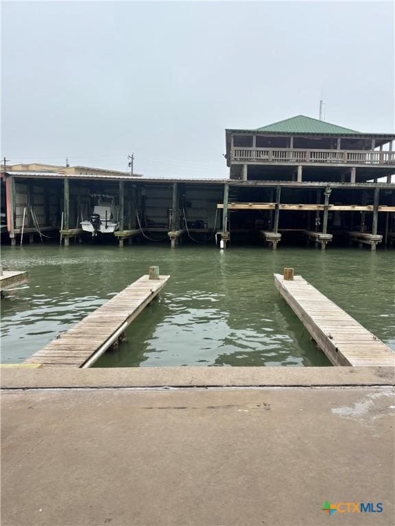 dock area with a water view