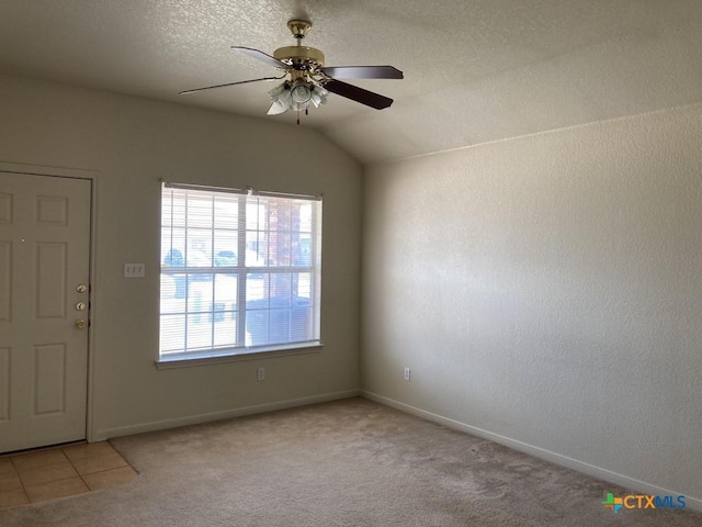 carpeted foyer with a textured ceiling, ceiling fan, and lofted ceiling