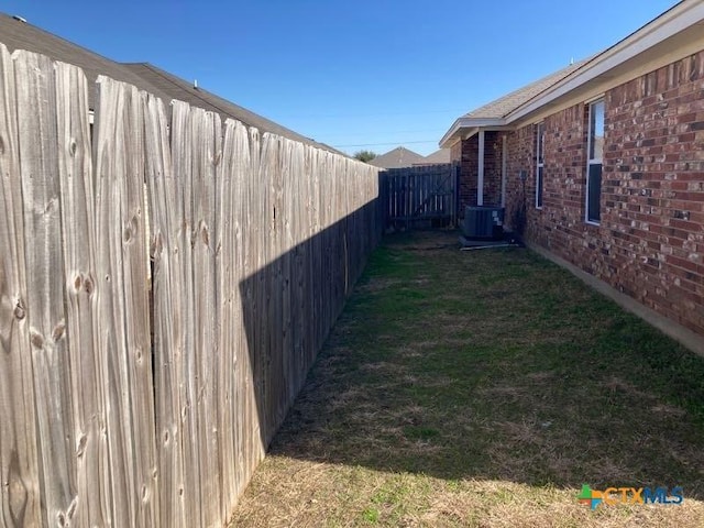 view of yard with central AC