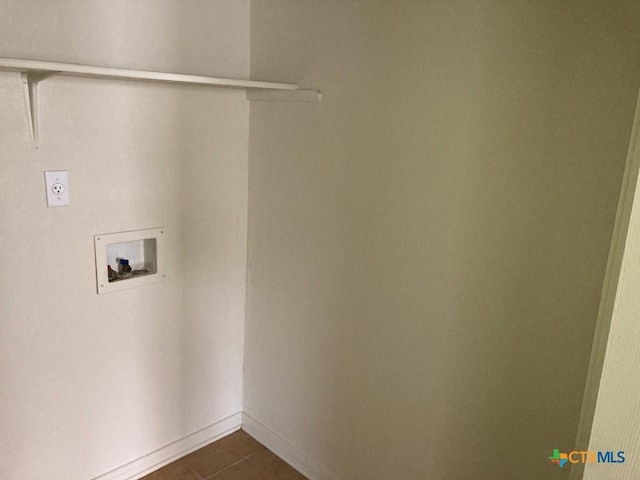 laundry area featuring dark tile patterned floors, washer hookup, and hookup for an electric dryer