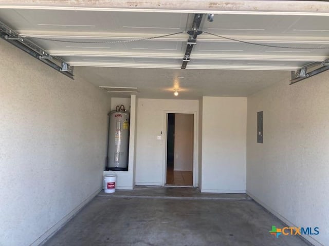 garage featuring electric panel and water heater