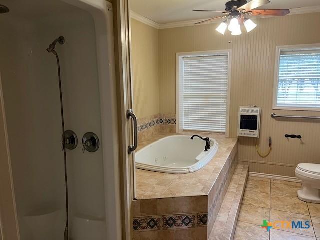 bathroom with ornamental molding, toilet, tile patterned flooring, and heating unit