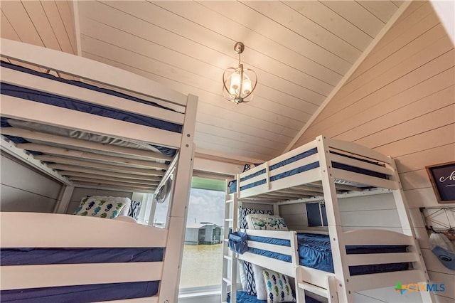 77 Sailfish Lndg, Port Lavaca, TX 77979 - bedroom with vaulted ceiling and wood walls