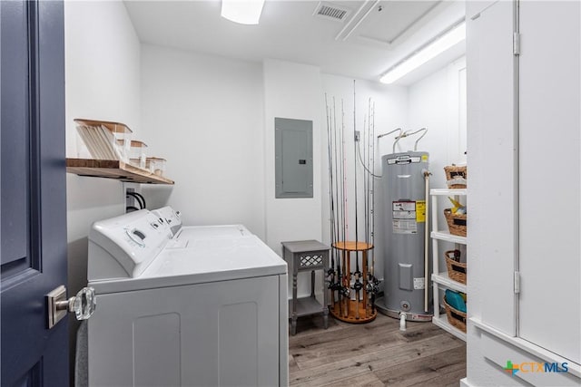 77 Sailfish Lndg, Port Lavaca, TX 77979 - laundry room with electric water heater, electric panel, washing machine and dryer, and light wood-style floors