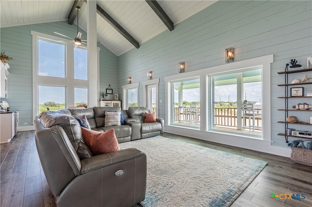 77 Sailfish Lndg, Port Lavaca, TX 77979 - living room with wooden walls, high vaulted ceiling, beam ceiling, ceiling fan, and dark wood-style floors