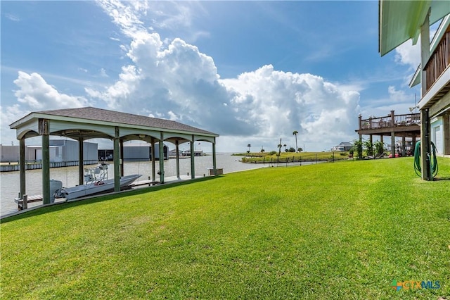 77 Sailfish Lndg, Port Lavaca, TX 77979 - view of grassy yard featuring a water view, a boat dock, and boat lift