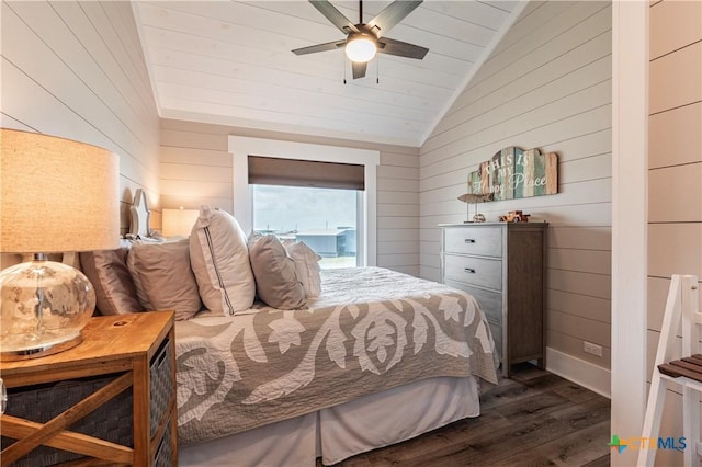 77 Sailfish Lndg, Port Lavaca, TX 77979 - bedroom with dark wood-type flooring, lofted ceiling, wooden walls, and ceiling fan