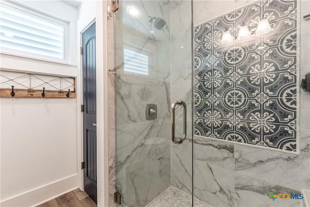 77 Sailfish Lndg, Port Lavaca, TX 77979 - bathroom with a marble finish shower and wood finished floors