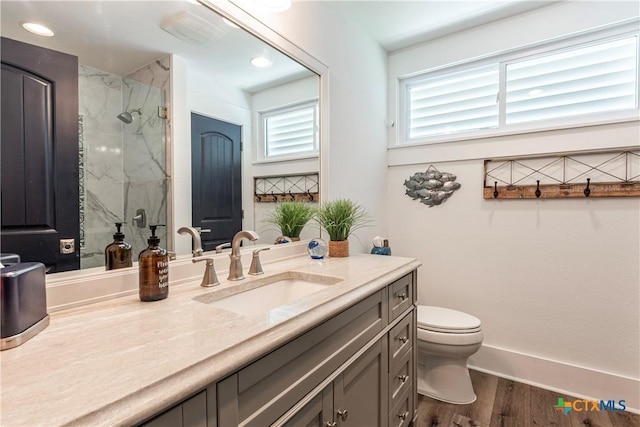 77 Sailfish Lndg, Port Lavaca, TX 77979 - full bathroom with a marble finish shower, vanity, and wood finished floors