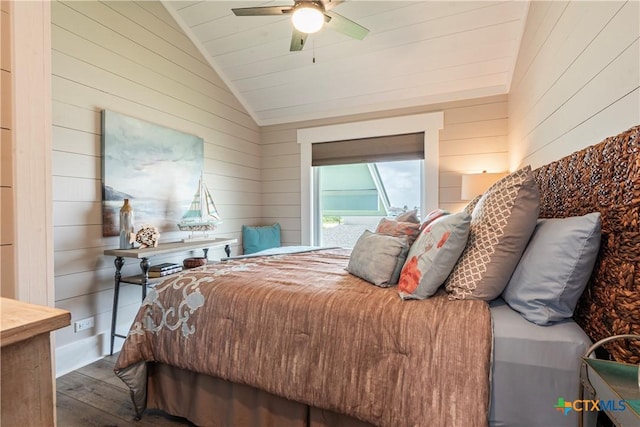 77 Sailfish Lndg, Port Lavaca, TX 77979 - bedroom featuring lofted ceiling, wood-type flooring, wooden walls, and a ceiling fan