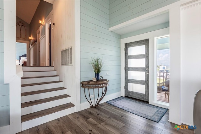 77 Sailfish Lndg, Port Lavaca, TX 77979 - foyer featuring wood finished floors, wooden walls, and stairs