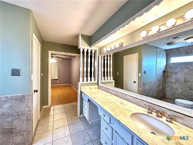 bathroom featuring vanity, tile patterned flooring, and a textured ceiling