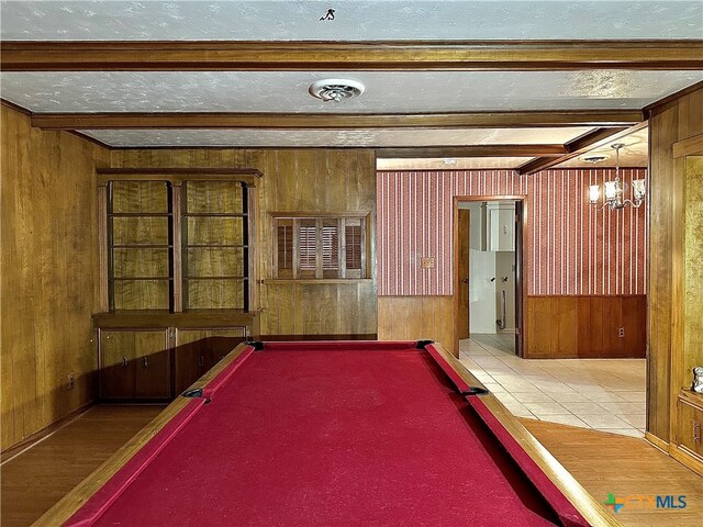 playroom with hardwood / wood-style floors and wooden walls