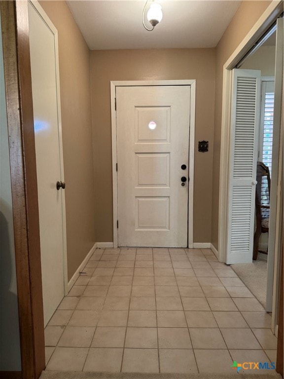 entryway featuring light tile patterned floors