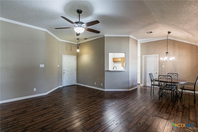 interior space with ornamental molding, dark wood-type flooring, ceiling fan with notable chandelier, and visible vents