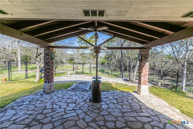 view of patio / terrace with a gate, visible vents, ceiling fan, and fence