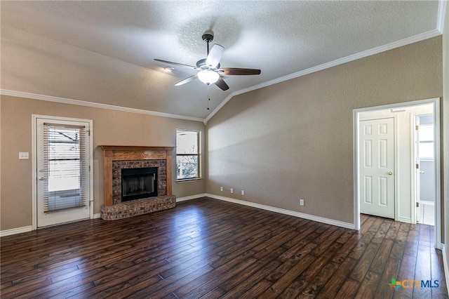 unfurnished living room featuring crown molding, lofted ceiling, a fireplace, and dark wood finished floors