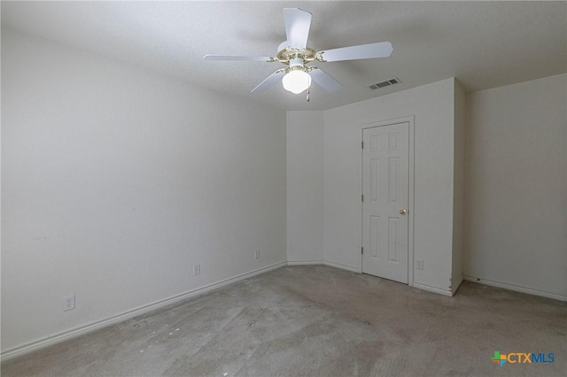 unfurnished bedroom featuring a ceiling fan, baseboards, visible vents, and carpet flooring