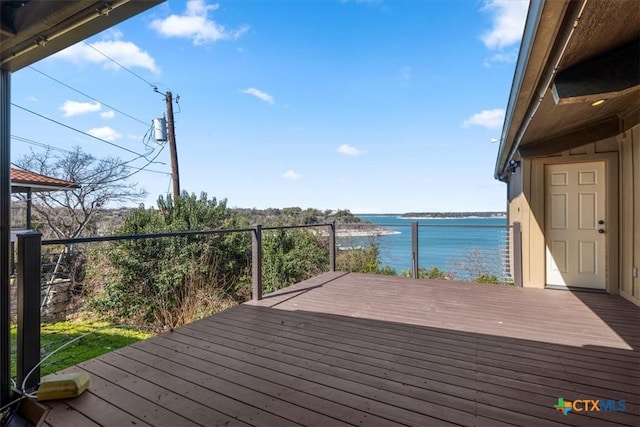 wooden deck featuring a water view