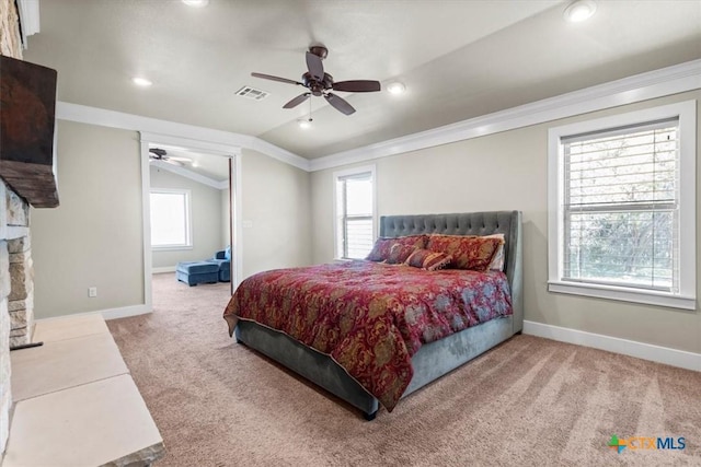 bedroom with ornamental molding, lofted ceiling, carpet flooring, and multiple windows