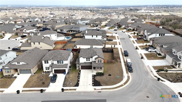 birds eye view of property with a residential view