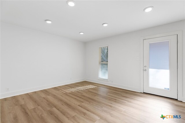 5820 Berkman Dr Unit 116, Austin, TX 78723 - unfurnished room with recessed lighting, baseboards, and light wood-type flooring
